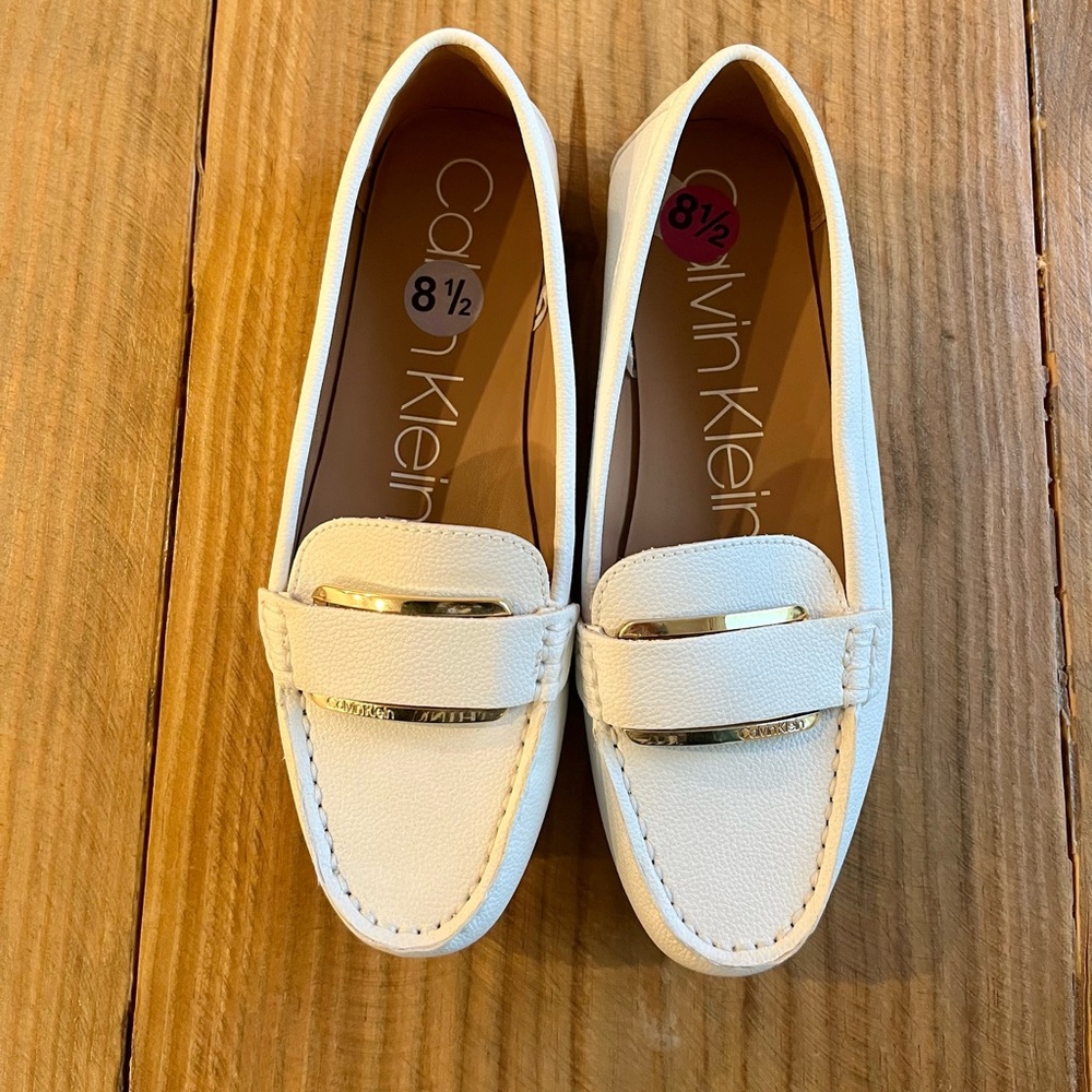 Never worn!!! Calvin Klein women’s size 8.5 white loafers with gold detail